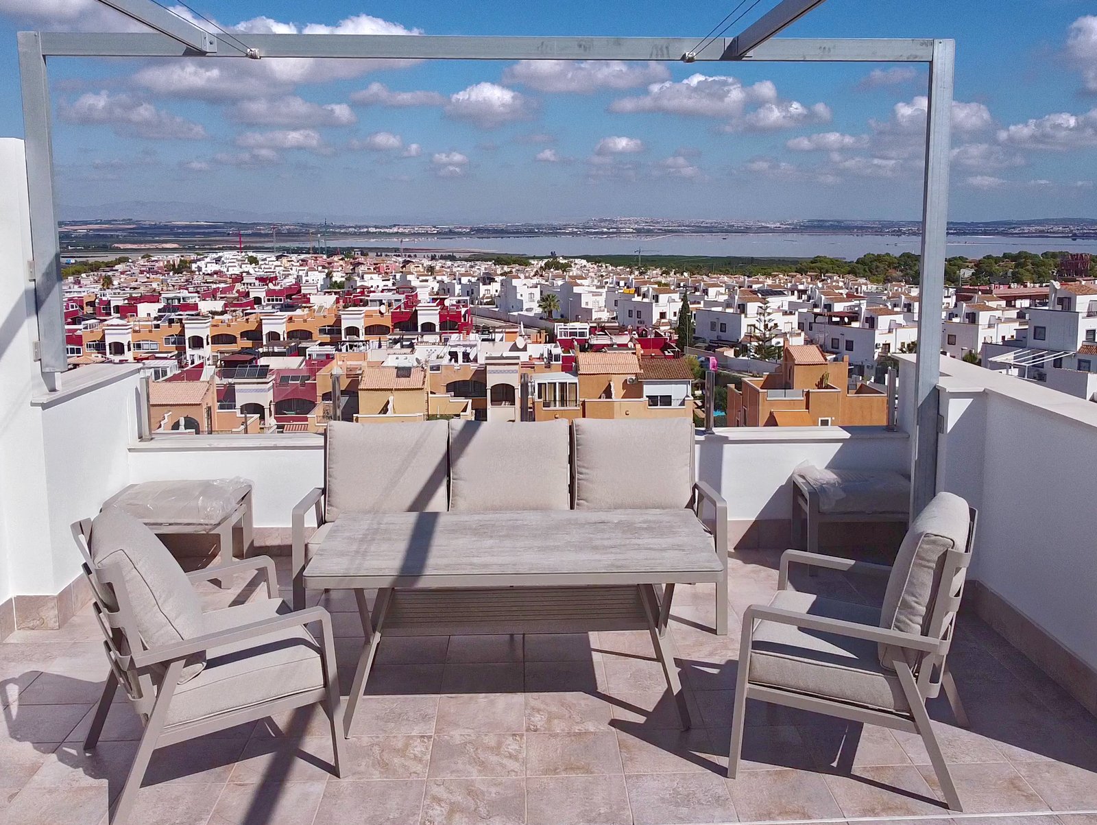 Private rooftop solarium with sun loungers and coastal views, luxury penthouse duplex in Orihuela Costa